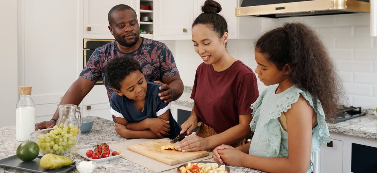 A happy family cooking and enjoying time together in a modern kitchen.