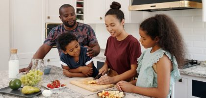 A happy family cooking and enjoying time together in a modern kitchen.