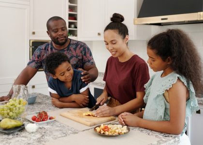 A happy family cooking and enjoying time together in a modern kitchen.